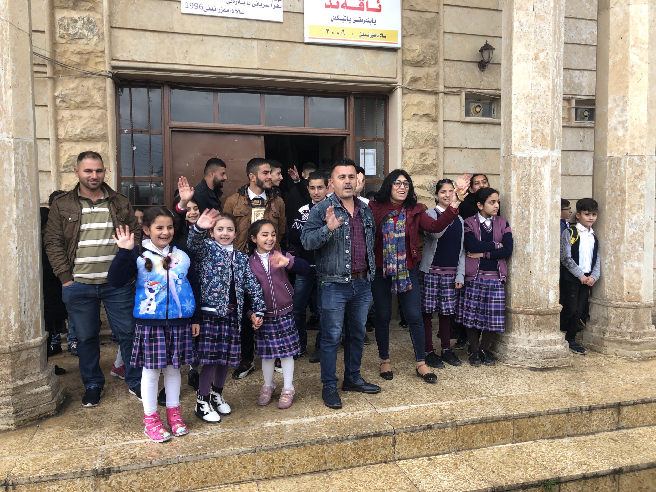 Schoolhouse with teachers and students